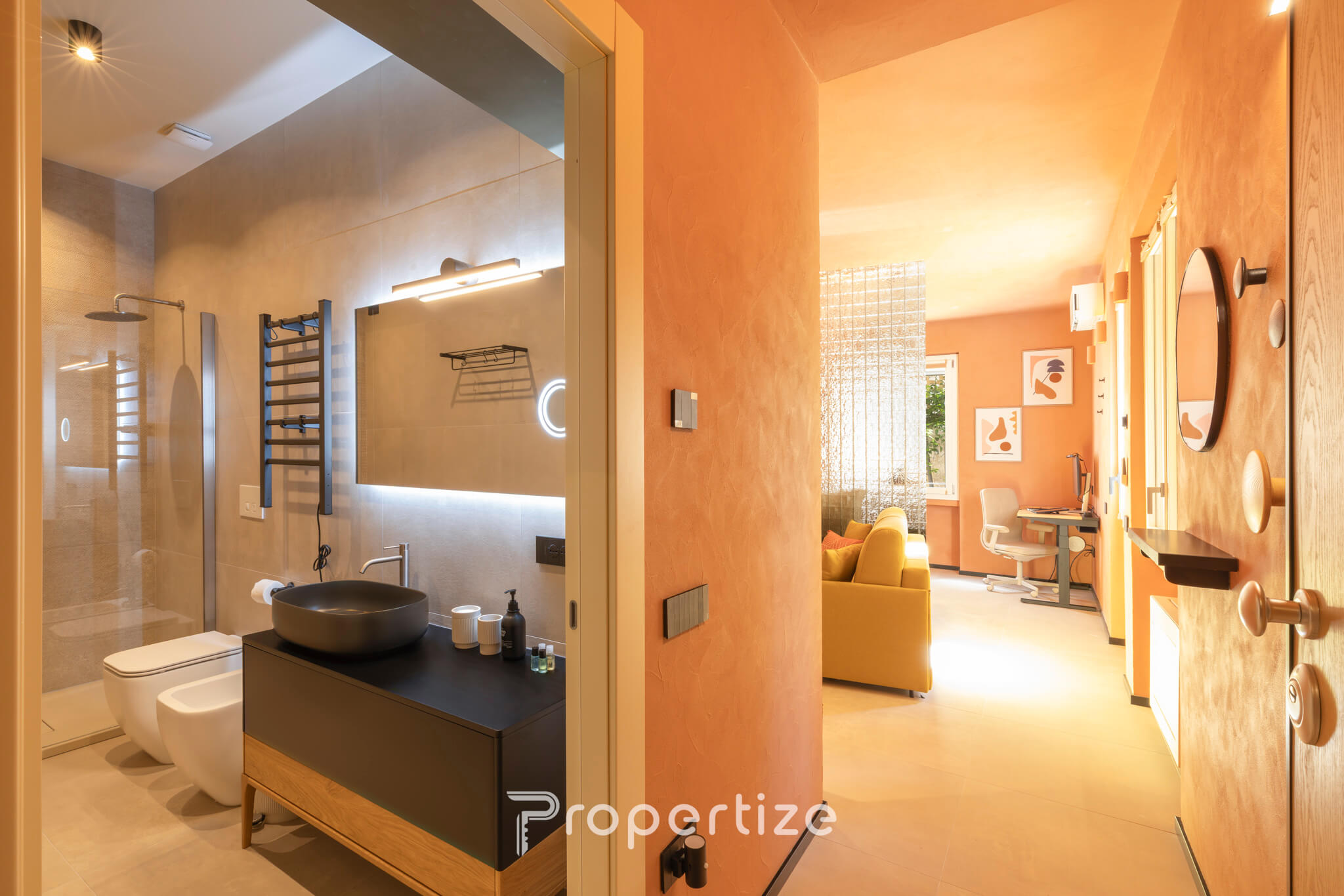 Open-plan living area and modern bathroom in Terra & Vidru Studio, Cagliari