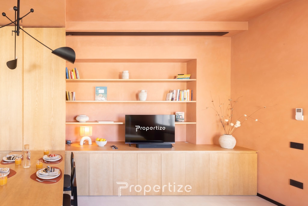 Terra & Vidru Suite — living room with peach walls, Stampace, Cagliari