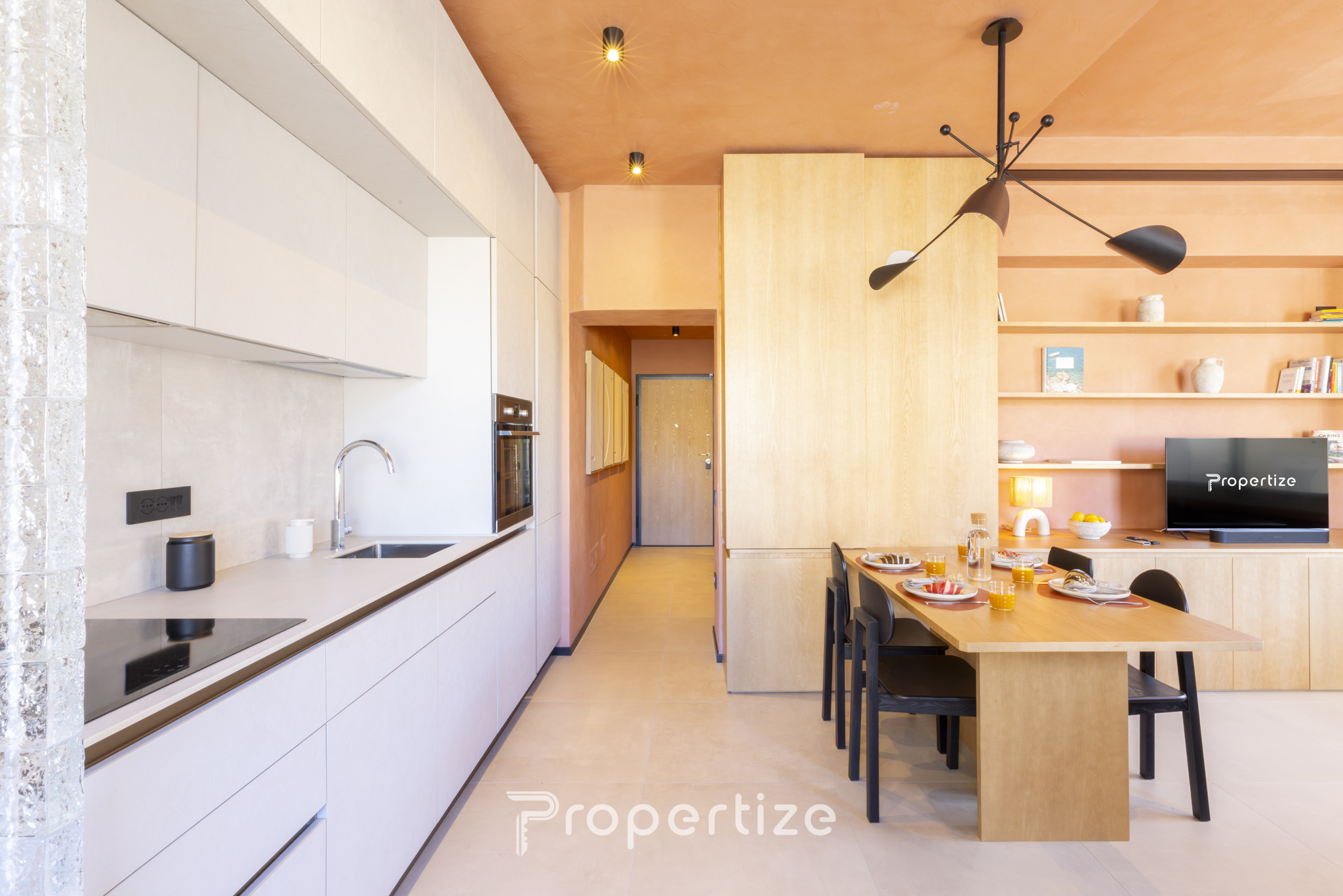 Full kitchen with espresso machine and dining area in Terra & Vidru Suite